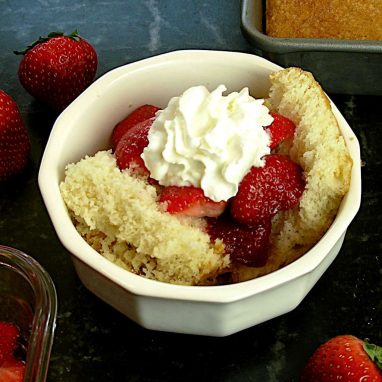 Shortcake topped with strawberries and whipped cream