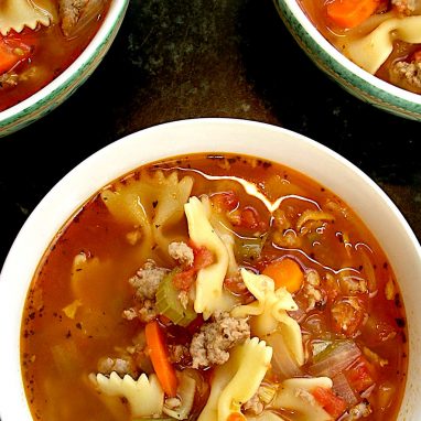 three bowls of pasta-sausage soup