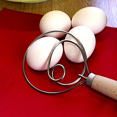 Danish whisk shown with eggs