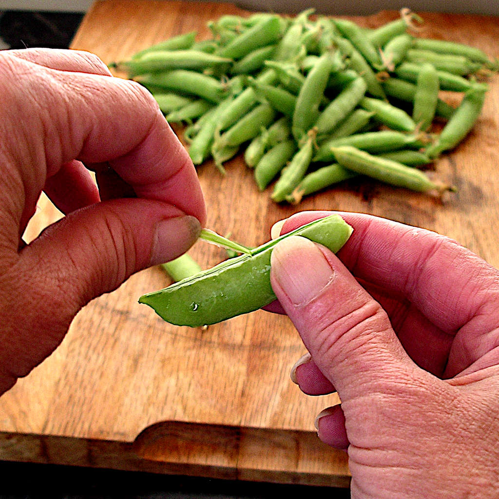 Stringing sugar snap peas